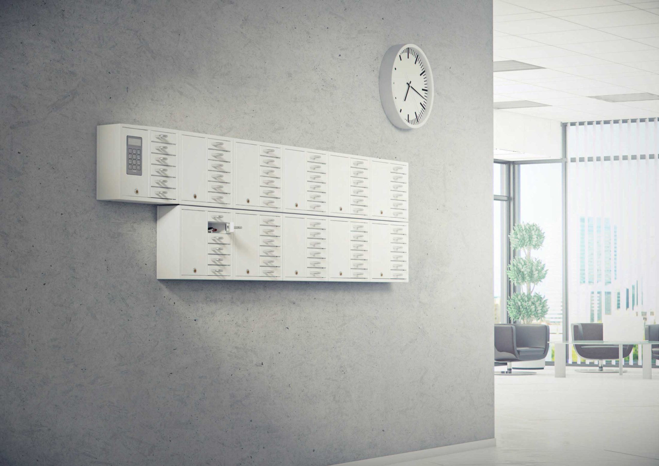The 9006 S key cabinet from the System series plus ten of the 9006 E from the Expansion series is handling the company's key management. Mounted on the wall with open compartments containing bunches of keys.